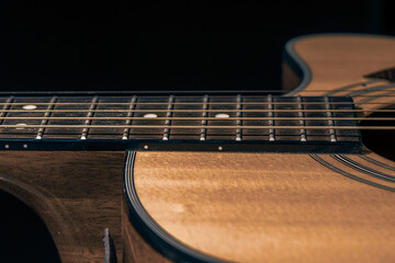 Obraz premium Close-up of a body part of an acoustic guitar.