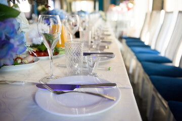 A table with food for the reception of guests. Festive design of the dining table at a banquet party.