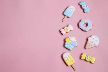 Colorful gingerbread cookies in colored glaze of different shapes.