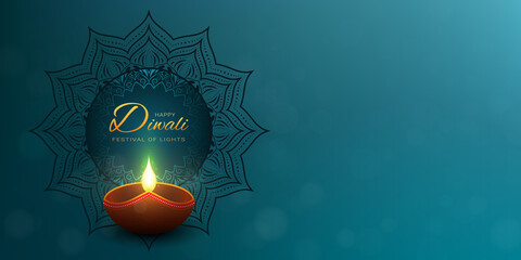 Happy Diwali turquoise background with gold greeting text. Dark mandala decoration behind the lighting diya lamp.