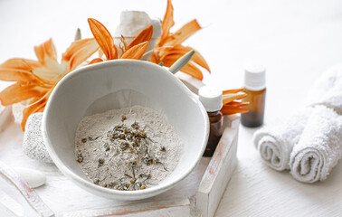Spa composition with powder face mask and natural oils.