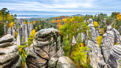 Prachov Rocks, Czech: Prachovske skaly, with colorful trees of autumn. Sandstone rock formation in...