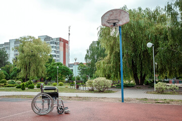 The concept of a wheelchair on the sports ground, a disabled person, a fulfilling life, paralyzed. Wheelchair on the basketball court.