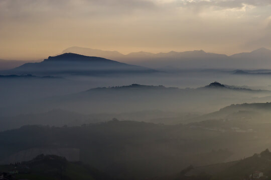 Mist Over The Hills In The Province Of Ascoli Piceno In Italy In The Morning