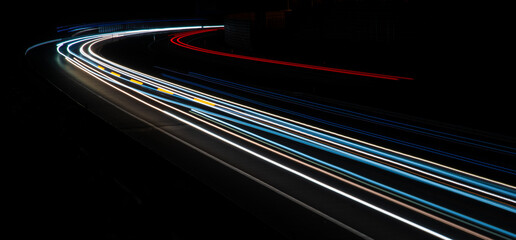 Night road lights. Lights of moving cars at night. long exposure multicolored