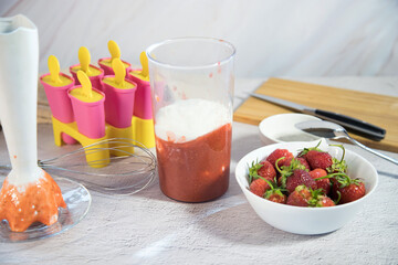 Making homemade ice cream with berries. Home cooking