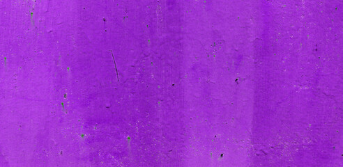 Old purple paint on aged wall