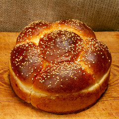 Round sweet bun with golden crust.