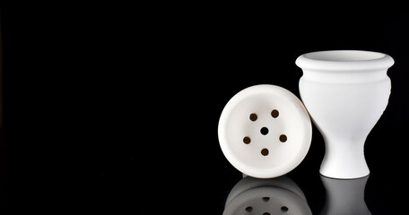 white hookah bowl on a black background. Space for text
