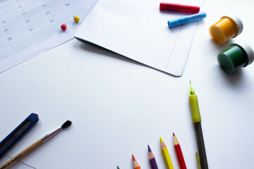 School  stationery on white background. Back to school creative layout, template with copy space. Flat lay, top view, overhead. Article about preparing for the school year. 
