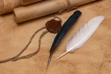 Antique medieval scroll, sealed with a seal. Feather for writing.