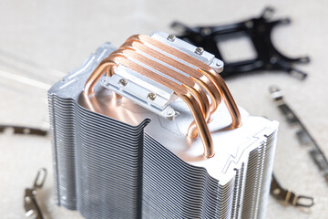 PC CPU air cooling system assembly kit. Aluminum heat sink with copper heat pipes, screws, springs...