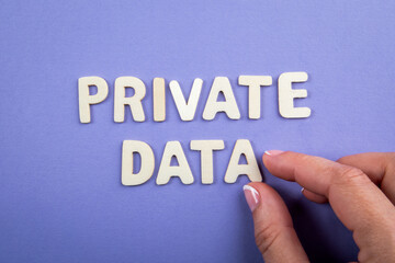 Private Data. White wooden letters with text on a purple background