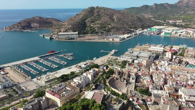 Panoramic aerial view of Cartagena city by Mediterranean coast overlooking port and marina with moored pleasure yachts, Spain