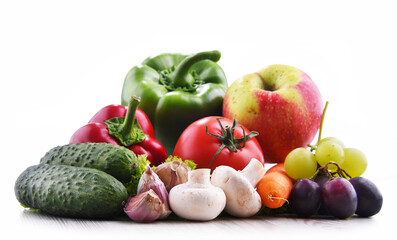 Composition with fresh vegetables and fruits isolated on white