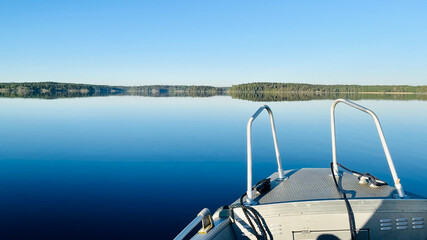 Driving across very smooth water. Not a wave as far as you can sea.