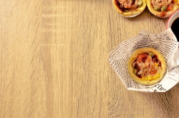 Tasty egg tart pizza on wooden backgrounds concept