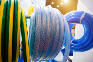 Roll of flexible hose rings. Flexible hose wrapped around the wheel