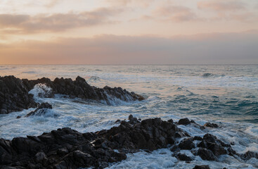 Landscape of rock formation in Barronal beach in Cabo de Gata nature park, Spain, during sunrise
