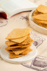 Kue semprong  is an Indonesian traditional wafer snack made by clasping egg batter using an iron mold which is heated up on a charcoal stove. The taste of this cake is not too sweet and will be crunch