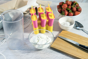 Ingredients for making homemade ice cream with strawberries. Home cooking