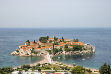 Top view of Sveti Stefan island. Details of architecture in the old town. Hotel of millionaires in the Mediterranean.