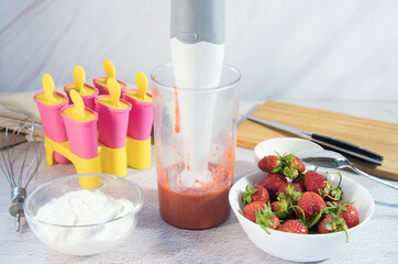 The process of making ice cream with berries at home. Home cooking