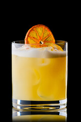 Variation of whiskey sour cocktail with orange syrup isolated on black