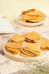 Kue semprong  is an Indonesian traditional wafer snack made by clasping egg batter using an iron mold which is heated up on a charcoal stove. The taste of this cake is not too sweet and will be crunch