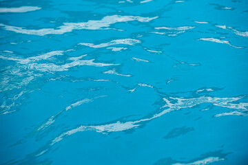 Fototapeta na wymiar Background of water, surface blue swimming pool.
