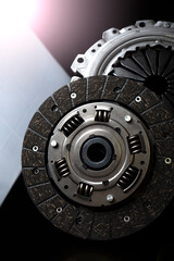 New clutch kit on a black table. Vertical photography.