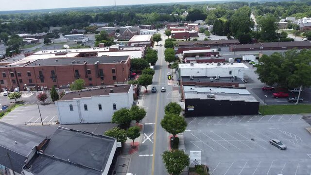 KERNERSVILLE, UNITED STATES - Jul 11, 2021: A panning aerial shot of a street in Kernersville, NC on a Sunny Summer afternoon
