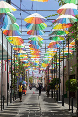 Street covered by umbrellas