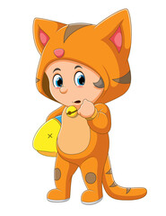 The little boy with the cat costume is holding the toy