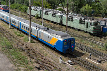 The old and the new train are nearby. Kazakhstan railway.