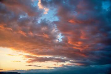 Naklejka na ściany i meble Beautiful cloudscape and dramatic sunset