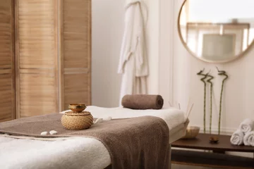Rolgordijnen Stylish room interior with massage table in spa salon © New Africa