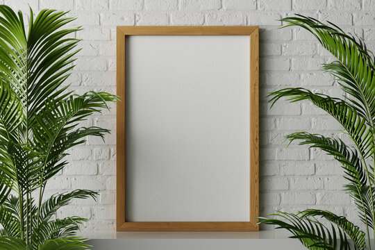 3d rendering of a standard 24 x 36 inch standing with canvas paper for poster or artwork mockup with walnut wood frame on the white clean surface in minimal cozy natural white brick interior