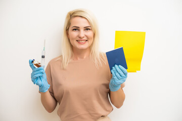 Portrait smart confident Caucasian female traveler holding virus, showing syringe and passport with vaccinated immune certification