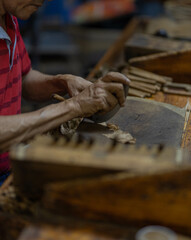 Cigar being made by hand