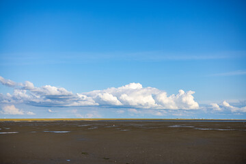 clouds on the beach and wide horizon with much copy space