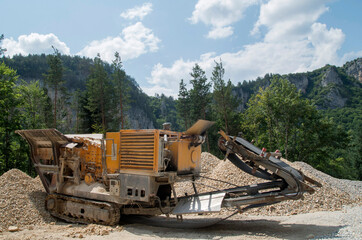 Fototapeta premium Old small mobile stone crusher crawler machine