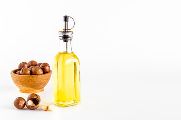 Macadamia essence oil with macadamia nuts. Organic product for food or cosmetic