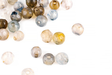 Beads made of natural gray agate on a white background are isolated