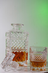 Alcoholic drink in a beautiful old glass and decanter