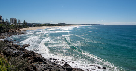 Gorgeous view of low tides in the sea washing up ashore at the Sunshine Coast in Australia