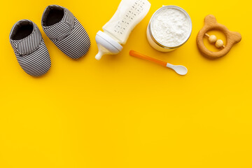 Baby bottle milk formula and powdered milk in a jar for baby feeding