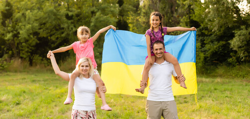 happy family with flag of ukraine in field. lifestyle