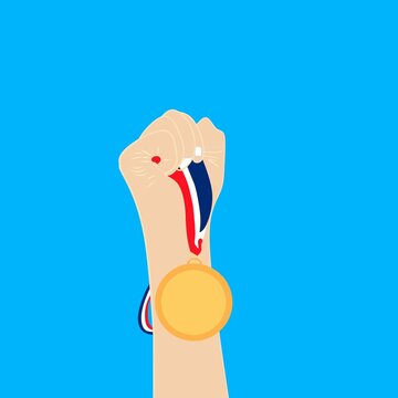 hand holding a medal with an upward direction when winning the fight