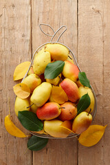 Pears in pear shape metal fruit basket